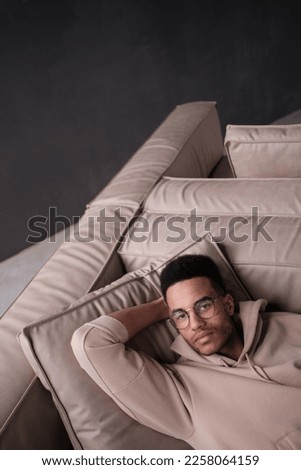 Handsome african american man wearing casual clothes and glasses happy face smiling looking at the camera. positive person. 
