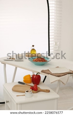 Professional equipment and composition with delicious spaghetti on white wooden table in studio. Food photography