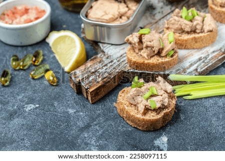toasts with Cod Liver pate on whole grain bread. Detox and healthy superfoods concept.