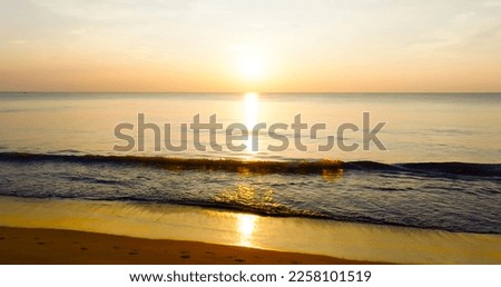 Sunset on tropical sea beach at Phuket Thailand