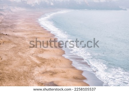 Bakers Beach aerial view over Californian sandy beach near San Francisco Bay, Pacific Ocean, gorgeous seascape, in light mist, perfect travel and vacation destination