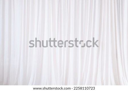 Texture of backdrop white cloth dropped down as a straight line, luxury, suitable for design and production of product advertising background,Background for inserting text on empty spaces.