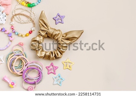 Set of baby girl hair accessories. Fashion hair bows, hair clips, hairpins and hair elastics.  Hairstyles for girls with stylish accessory.  Royalty-Free Stock Photo #2258114731