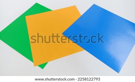 green orange and blue folding papers