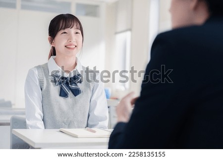 A high school girl receiving career guidance during an interview Royalty-Free Stock Photo #2258135155