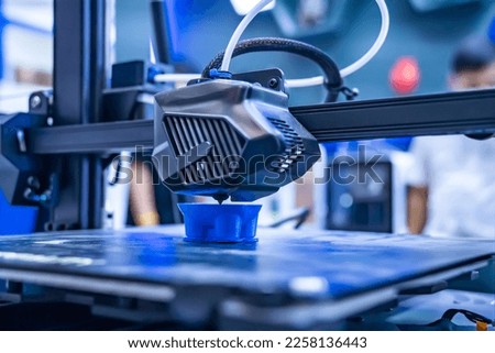 3D printer or additive manufacturing and robotic automation technology.  Royalty-Free Stock Photo #2258136443
