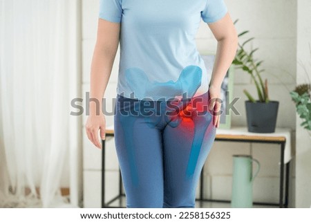 Hip joint pain, woman suffering from osteoarthritis at home, health problems concept, BeH3althy Royalty-Free Stock Photo #2258156325
