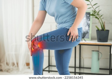 Knee pain, woman suffering from osteoarthritis at home, chiropractic treatments concept, BeH3althy Royalty-Free Stock Photo #2258156345