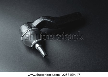 Close-up of Tie Rod or Ball Joints. New spare part for steering tie rod. Trade in spare parts or car service. Selective focus Royalty-Free Stock Photo #2258159147