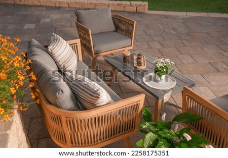 close up,wood sofa and table made of metal and wood in the yard and garden on the garden tiles	