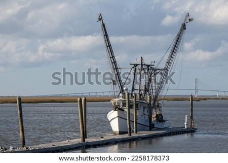 Commercial fishing vessel moored at a dock on the Intracoastal Waterway in Georgia Royalty-Free Stock Photo #2258178373