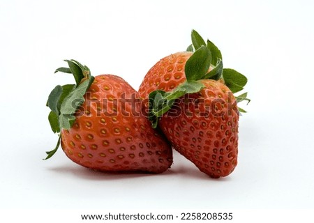 pictures of strawberries on wood with an white background