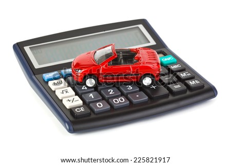 Calculator and toy car isolated on white background