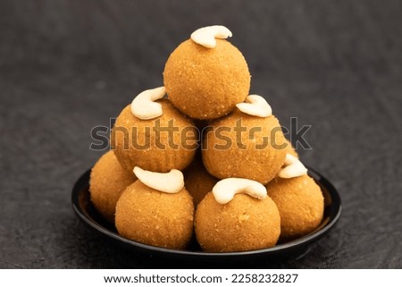 Traditional Ball Shaped Indian Mithai Besan Ke Laddu, Ladoo Or Laddoo Made from Bengal Gram Flour, Chickpeas, Dry Fruits, Nuts And Roasted In Desi Ghee Or Clarified Butter Royalty-Free Stock Photo #2258232827
