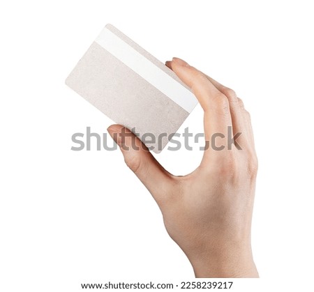 Reverse side of bank card in hand. holding credit bankcard, back view isolated on white background. High quality photo
