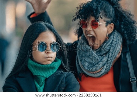 couple of friends on the street arguing angry Royalty-Free Stock Photo #2258250161