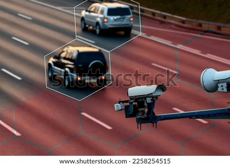 Ai tracking traffic automobile, Camera that controls speeding cars and speeding on the road. The camera reads the speed, Artificial intelligence that tracks traffic, a car that recognizes the speed Royalty-Free Stock Photo #2258254515