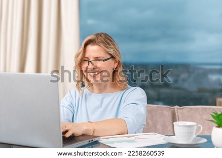 Happy business lady working from home. Home office. Smiling business woman using laptop in office. Freelancer at work. remote working. Video Conference. Smiling european woman having web call