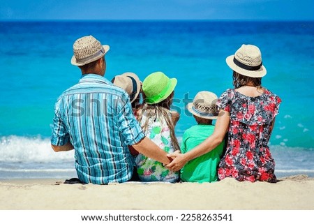 Happy family with children on the coast of the sea travel