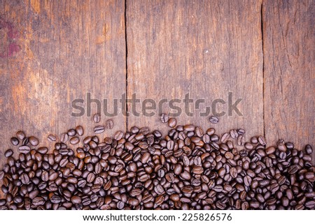 Coffee beans on grunge wooden for  background