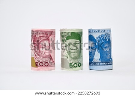 Rolled up Naira notes isolated on white background. Rolled up Naira Royalty-Free Stock Photo #2258272693