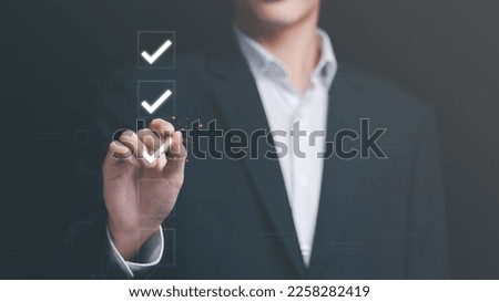 businessman check mark about exploring topics,In the virtual form check sheet,checklist ideas, checkbox ,Take an assessment, questionnaire, evaluation, document approval,online survey or test

