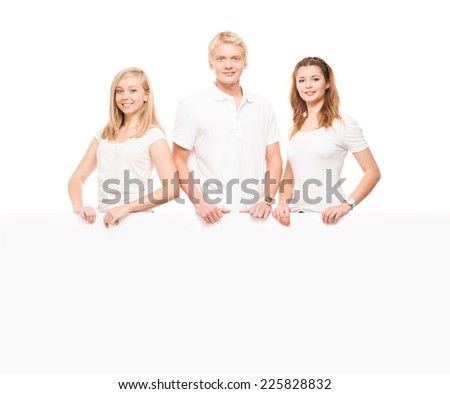 Group of teenagers with a blank, white billboard isolated on white
