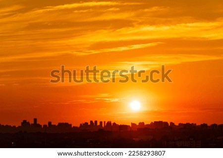 Toronto Canada scenic view of cityscape skyline at hot scorch summer evening sunset. Orange dusk sun lights and clouds. Climate change concept. Dramatic cloudscape. Royalty-Free Stock Photo #2258293807