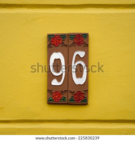 House number ninety six on two separate ceramic tiles