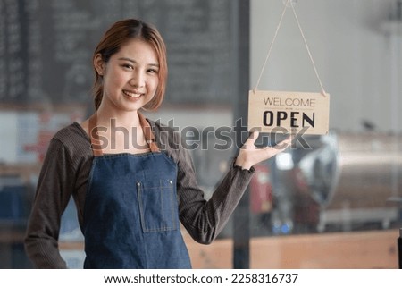 Welcome open shop barista waitress open sign on glass door modern coffee shop ready to serve restaurant cafe, retail small business owners.