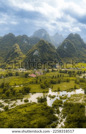 Vertical image of the Karst mountains surrounding Detian Ban Gioc waterfall in Guangxi Zhuang Autonomous region, China, Vietnam border Royalty-Free Stock Photo #2258318517