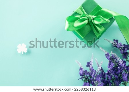 St Patricks Day decoration background concept. shamrocks leaves holiday symbol with copy space on pastel background, above view gift box green clover leaves festive decor, Banner greeting card