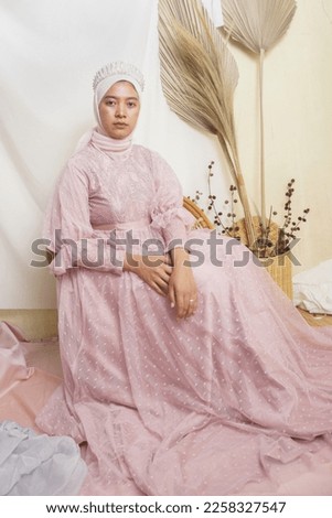 simple pose of asian girl in peach wedding dress              