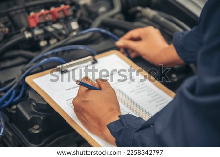 Close up Man hands fixing Car machinery vehicle mechanical service. Mechanic man hands repairing car auto repair shop. open vehicle hood checking up auto mobile. Vehicle Car maintenance engineer. Royalty-Free Stock Photo #2258342797