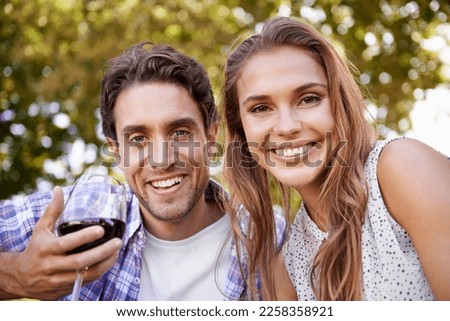 Love couple, portrait or wine on picnic, valentines day or romance date bonding in nature park or garden low angle. Smile, happy woman or man and alcohol drinks glass in marriage anniversary security
