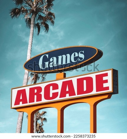 Vintage arcade games sign with palm trees