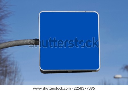 Blank empty copy space blue road sign with blue sky