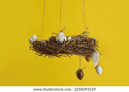 Beautiful Easter decor hanging near color wall