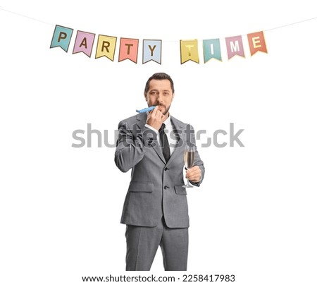 Businessman blowing a horn and holding a glass of champagne at a party isolated on white background