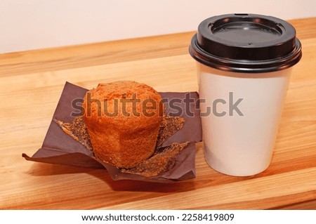 Coffee and muffin on the table