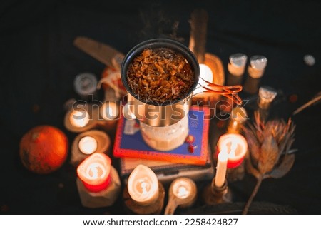 Close up camping pot with stew and candles concept photo. Portable cooking gear. Front view photography with blurred background. High quality picture for wallpaper, travel blog, magazine, article