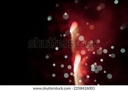 Abstract photo of firework fire. Blurry photo of firework in the shape of flame.