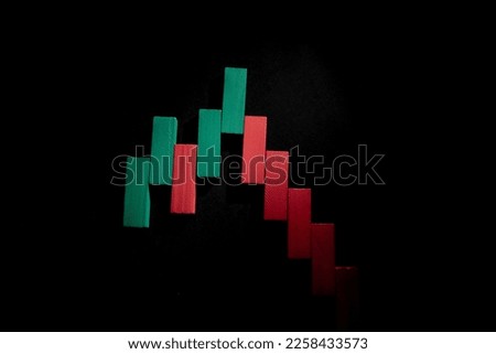 Financial chart made of small wooden blocks on a black background