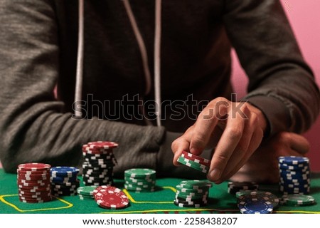 Man playing BlackJack at the casino Royalty-Free Stock Photo #2258438207