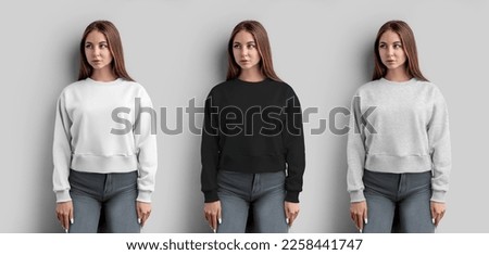 Mockup of white, black, heather crop sweatshirt on a beautiful girl, women's shirt for design, pattern, print, front view. Template of fashion casual clothes isolated on background, for advertising