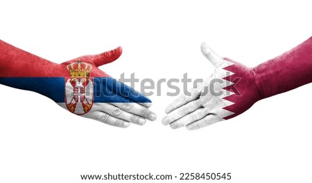 Handshake between Qatar and Serbia flags painted on hands, isolated transparent image.