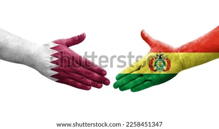 Handshake between Bolivia and Qatar flags painted on hands, isolated transparent image.