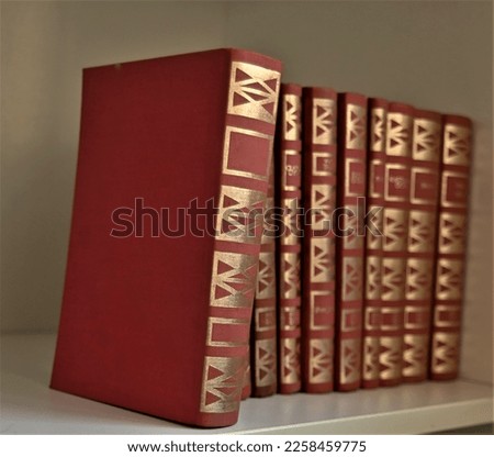 book edition
red books
books on the shelf
a series of books
books in a series
color book