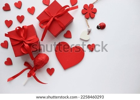 gift concept for valentine's day. red gift box and red heart isolated on white background