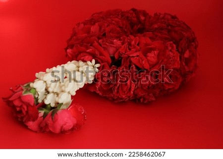 Red Roses with white Crown Flowers garland on red background Valentine's Day Concept , Mother's Day concept